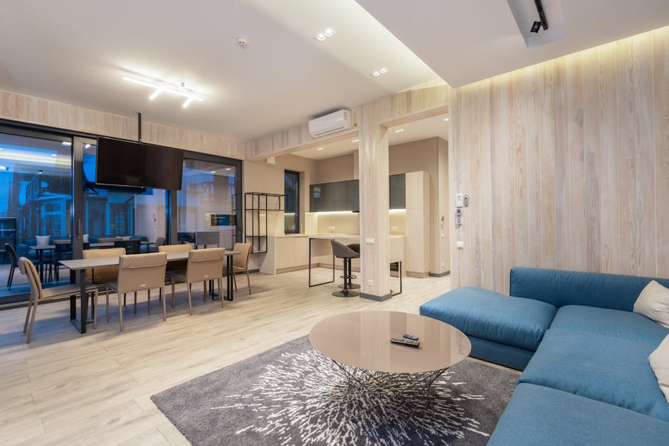 A living room being staged with modern furniture and decor